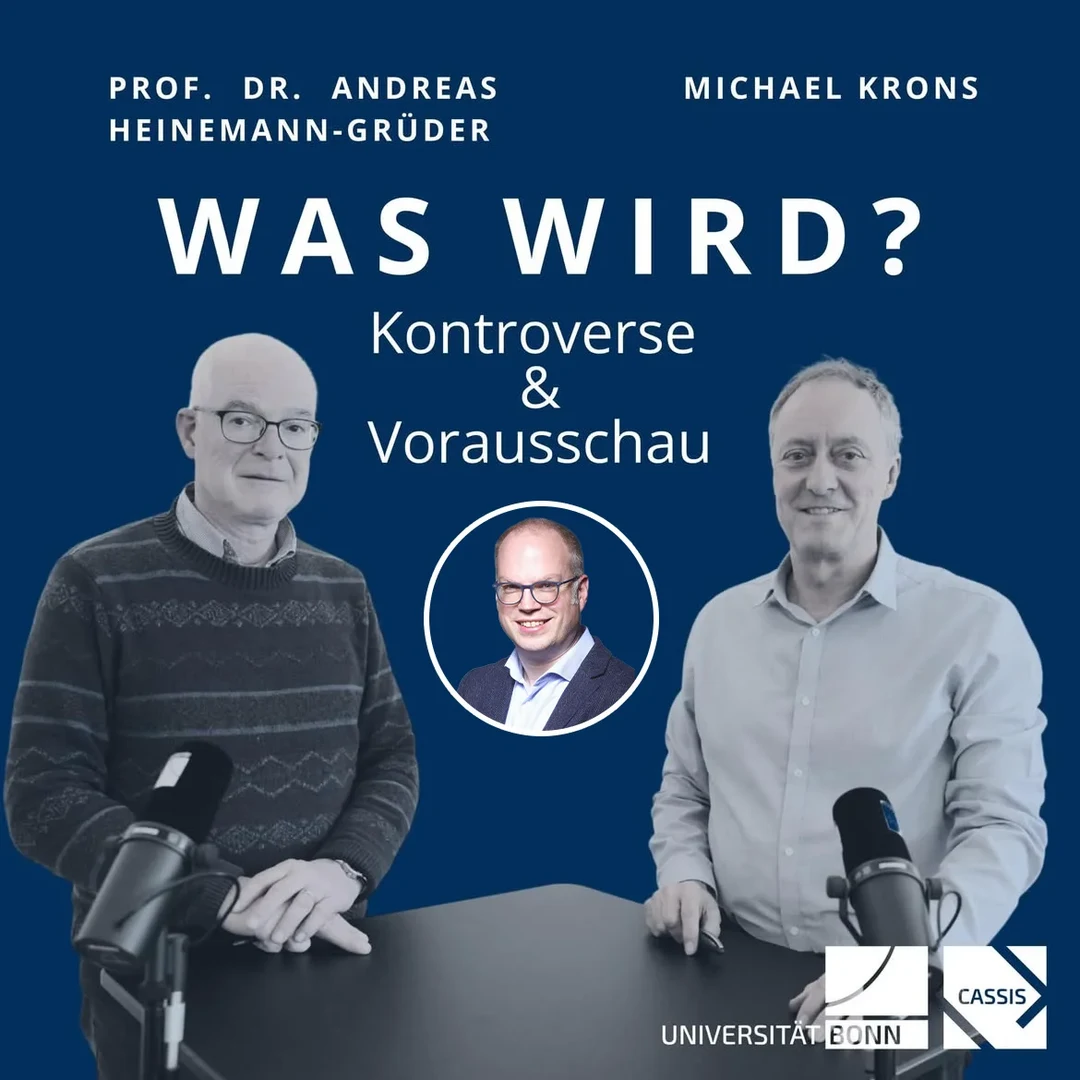 Eine Wissenschaftlerin und ein Wissenschaftler arbeiten hinter einer Glasfassade und mischen Chemikalien mit Großgeräten.